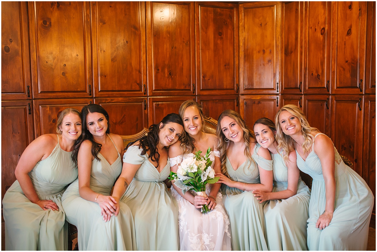 Bride with bridesmaids before the wedding ceremony at Crooked Willow Farms bridal suite