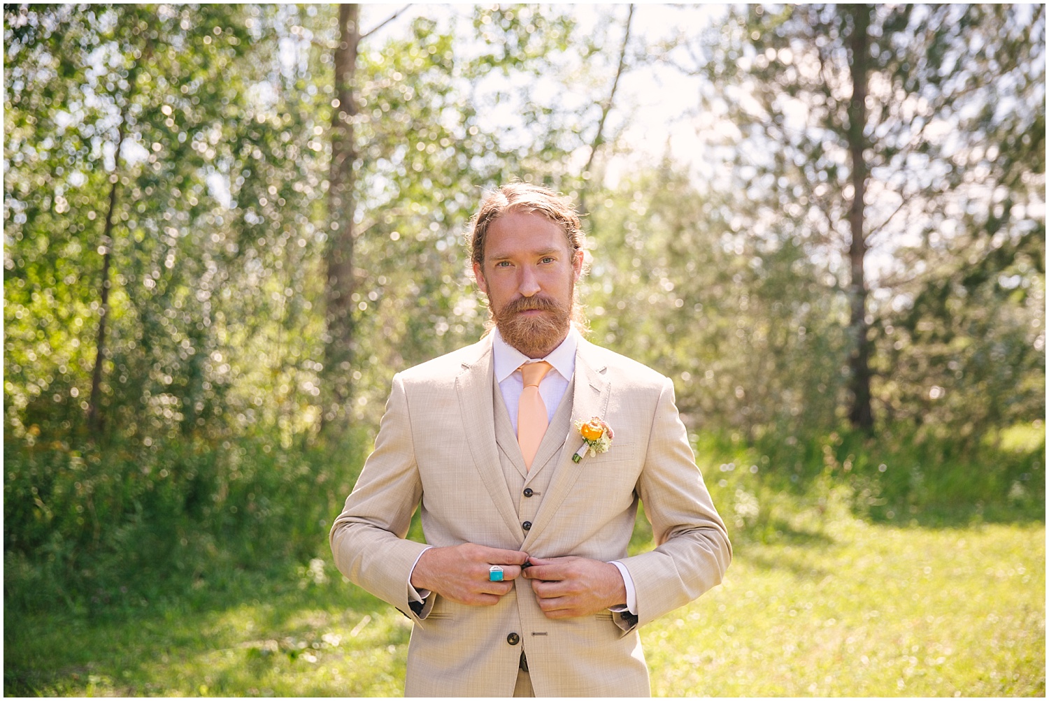 Groom in custom taupe suit by The Bespoke Edge at Lone Hawk Farm in Longmont Colorado