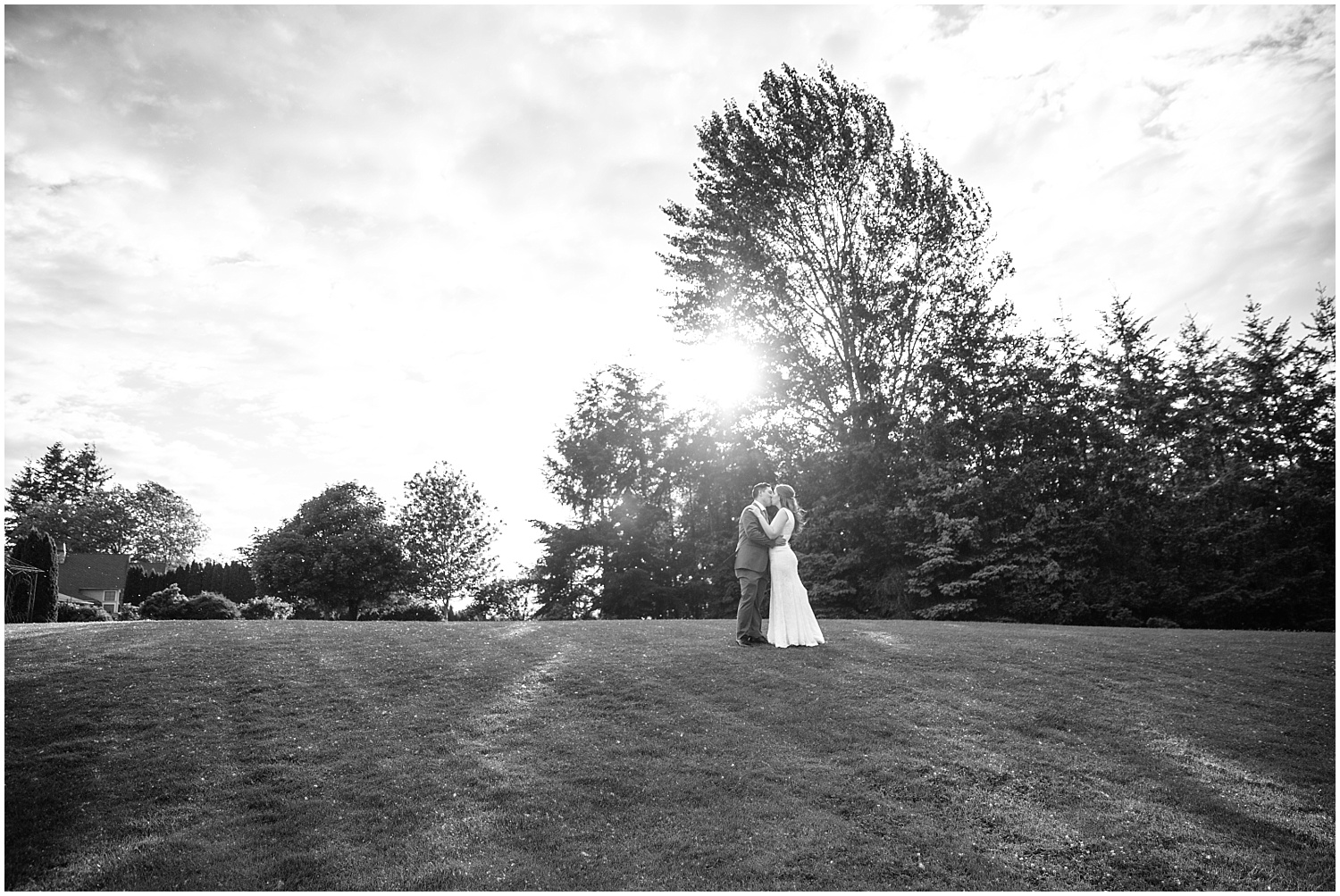 Black and white bride and groom portrait on the grassy hill at Lord Hill Farms wedding