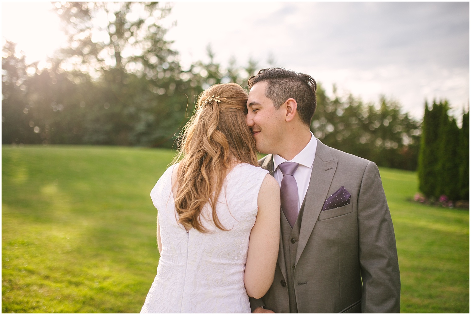 Groom nuzzles into his bride at Lord Hill Farms wedding