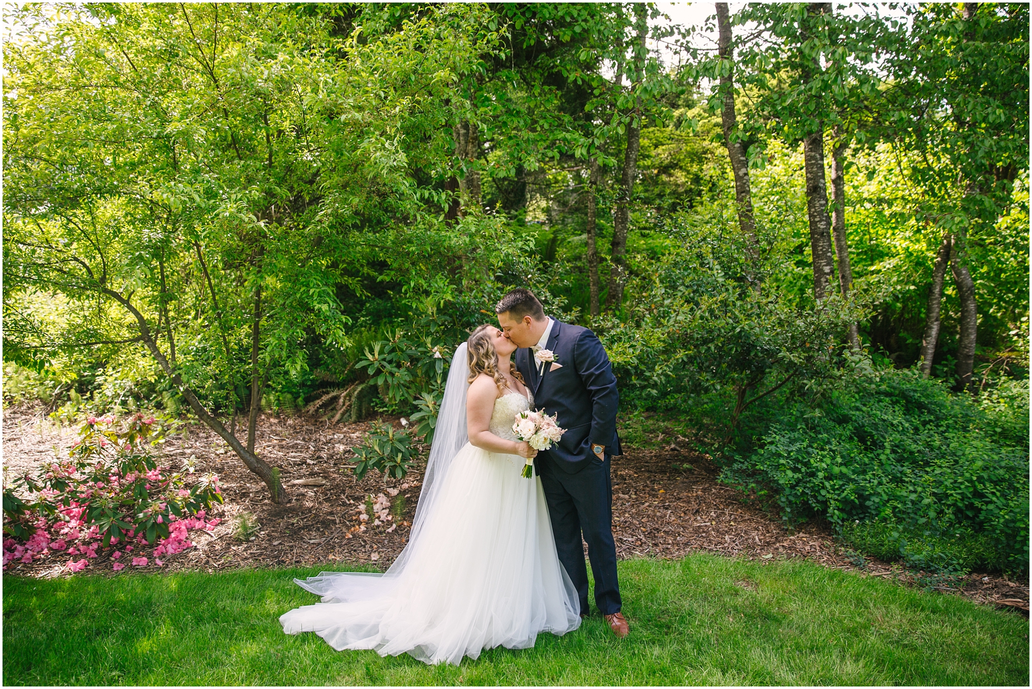 Bride and groom kissing under the trees in Issaquah Washington