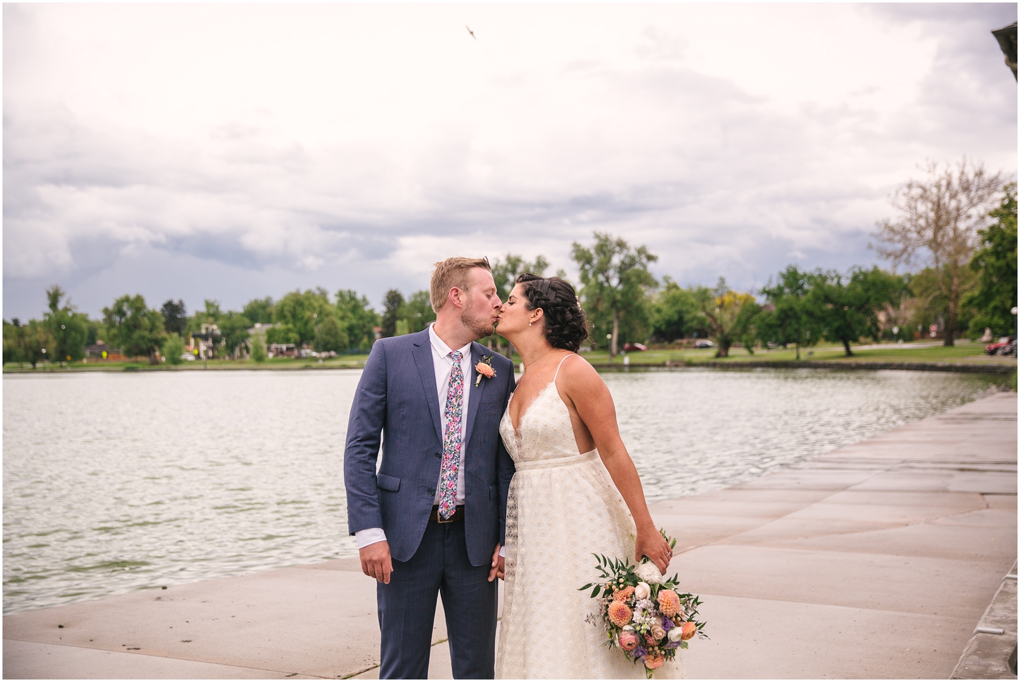 Bride and groom kissing on Smith Lake for Washington Park Boathouse wedding