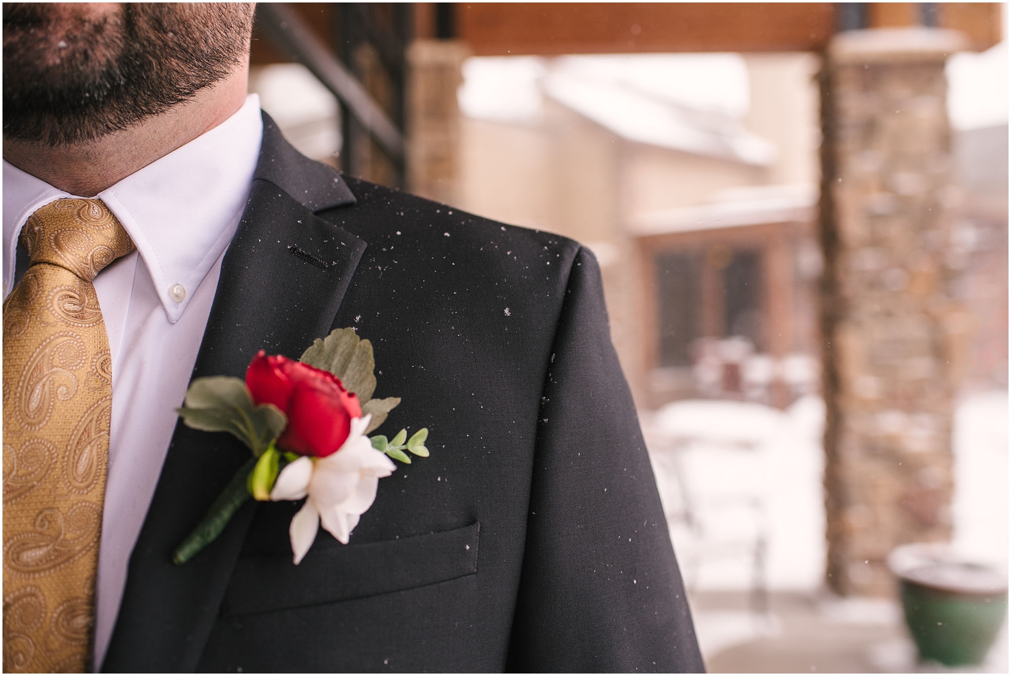 Groom's silk boutonniere for winter wedding at St Francis of Assisi Catholic Church