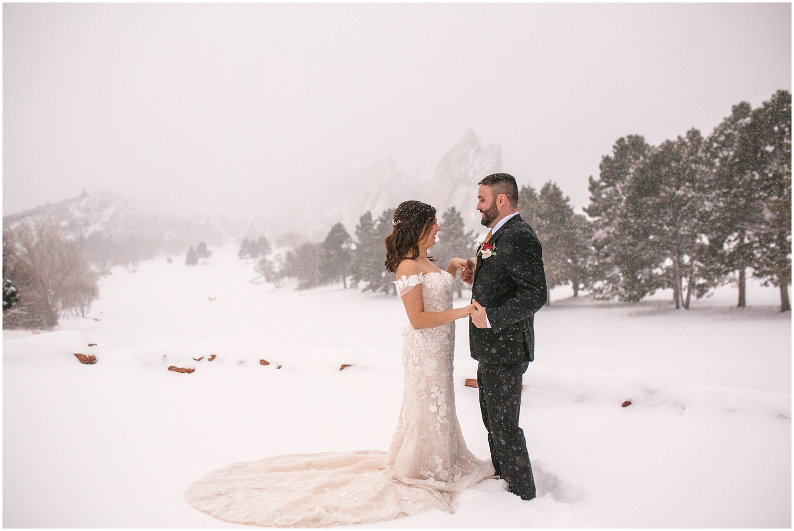 Bride and groom dancing in the snow at Arrowhead Golf Club winter wedding