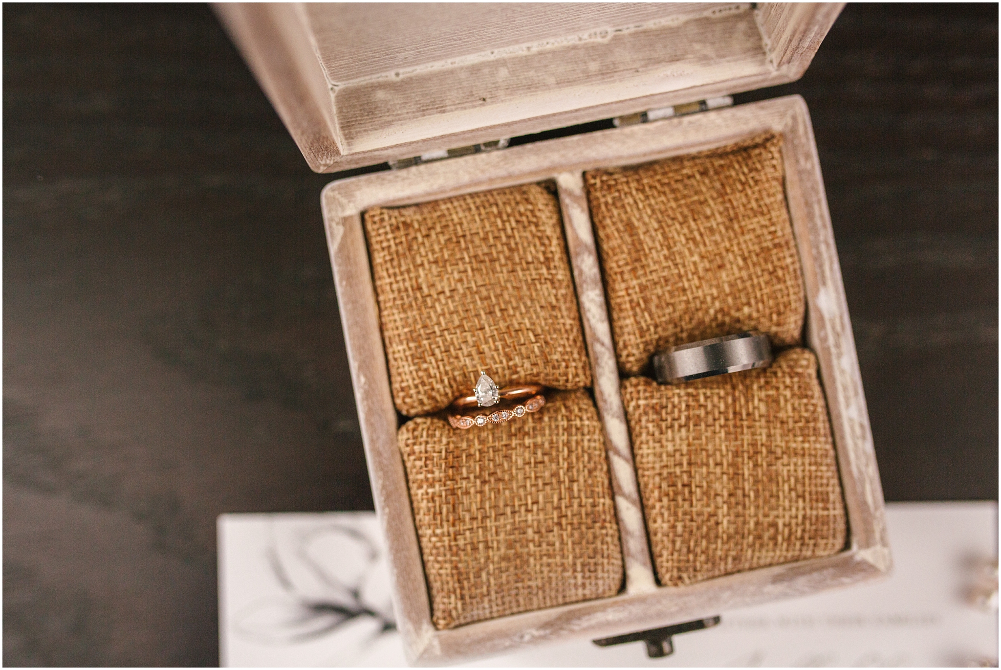 Wedding rings in rustic wooden ring box