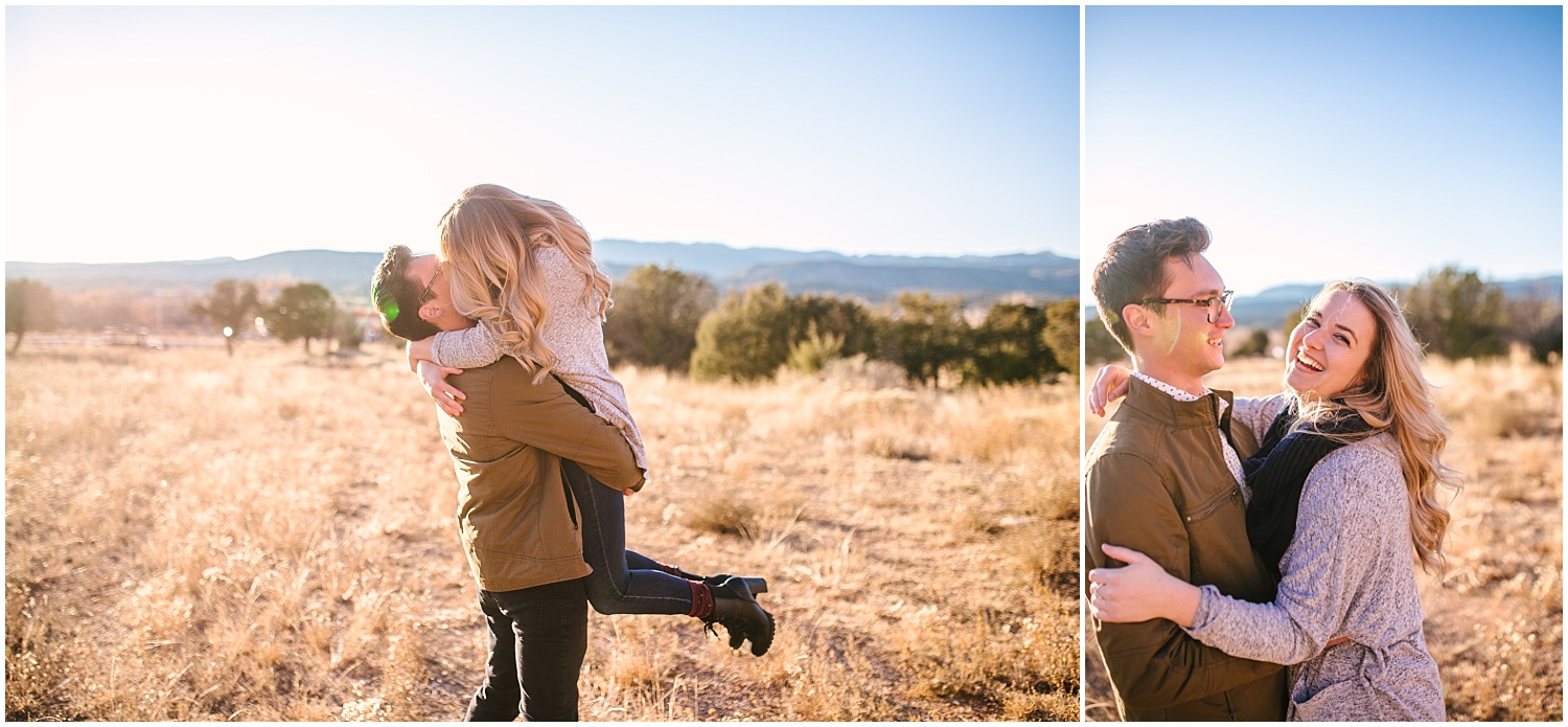 Guy swings girlfriend around during couples portraits at Jemez Red Rocks New Mexico