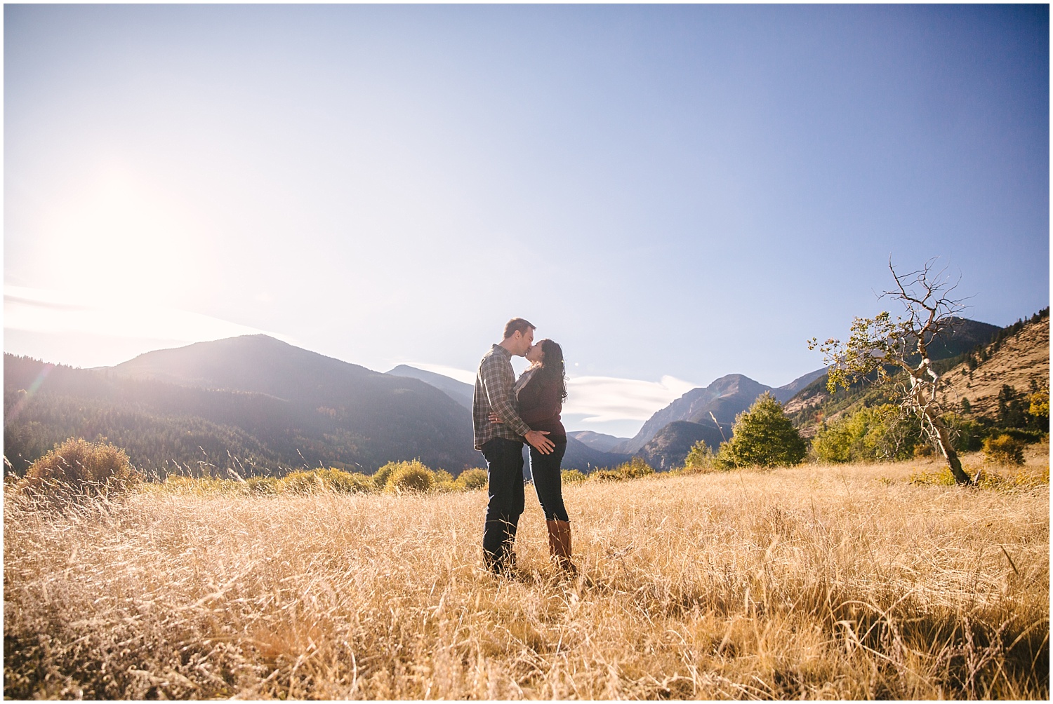 Couple kissing in a field in Endovalley at RNMP fall engagement