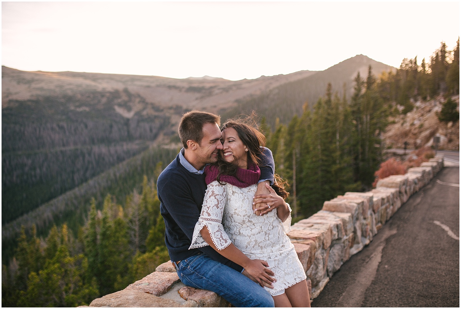 Couple cuddling along Trail Ridge Road at sunset for RMNP engagement