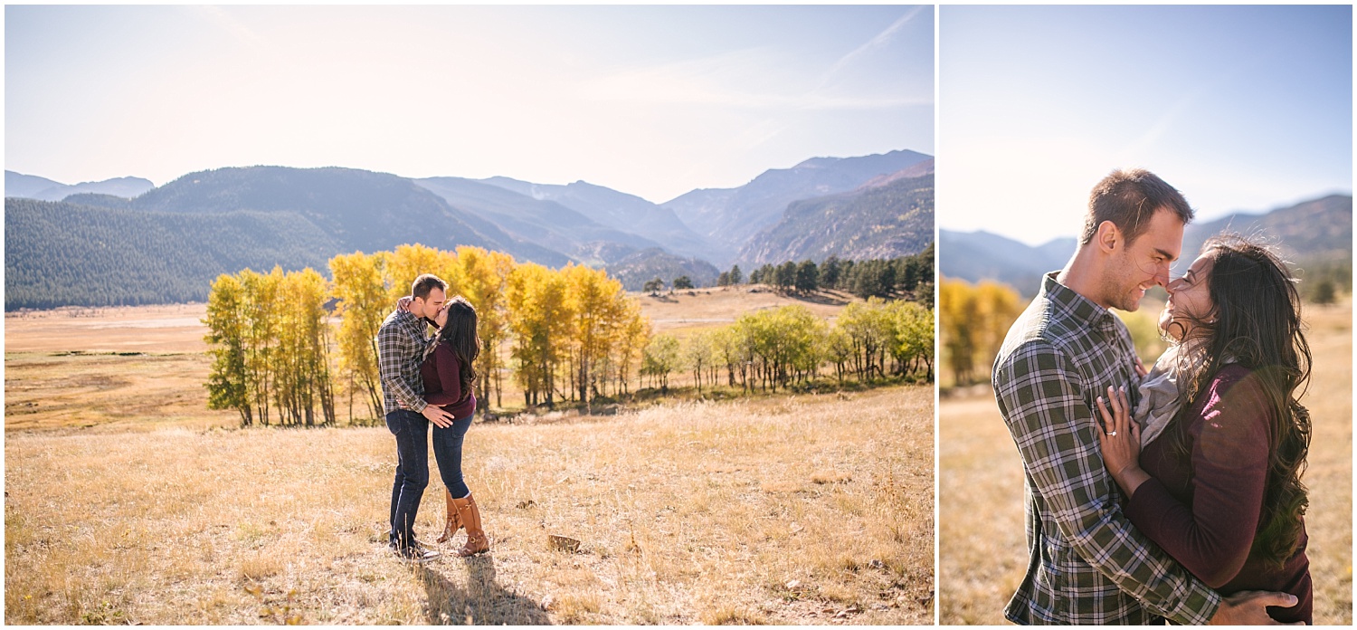 Couple kissing in field at Rocky Mountain National Park for fall engagement