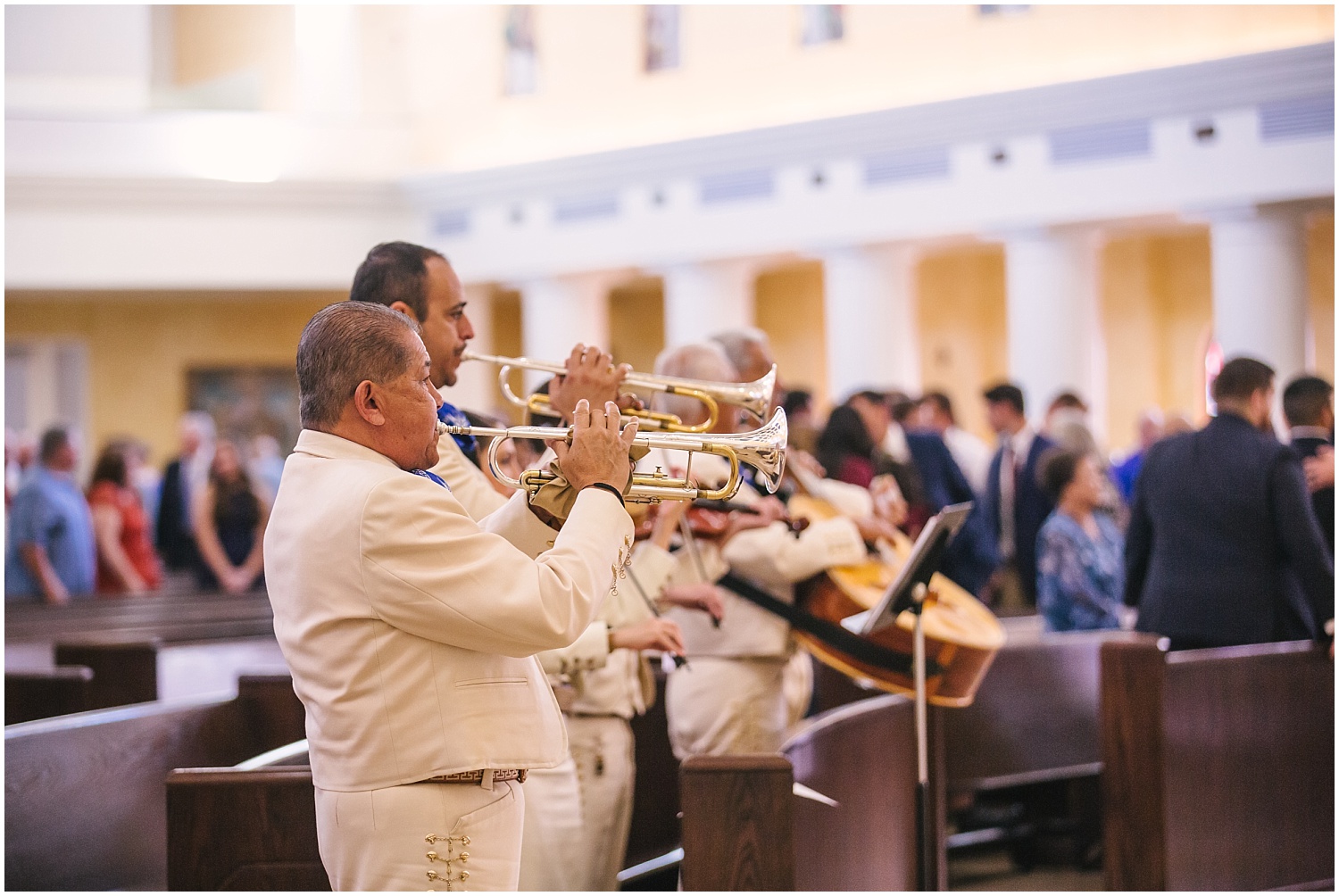 Mariachi band plays during wedding ceremony at Church of the Incarnation Catholic Church in Rio Rancho New Mexico