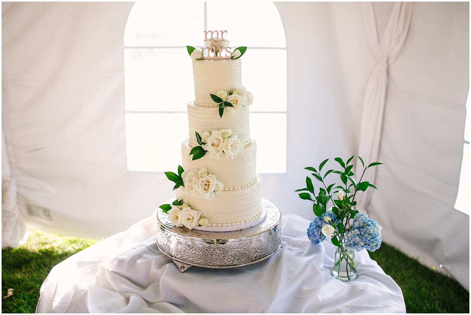 Four-tier wedding cake by Bizzy B Cakes for fall wedding at Prairie Star Restaurant