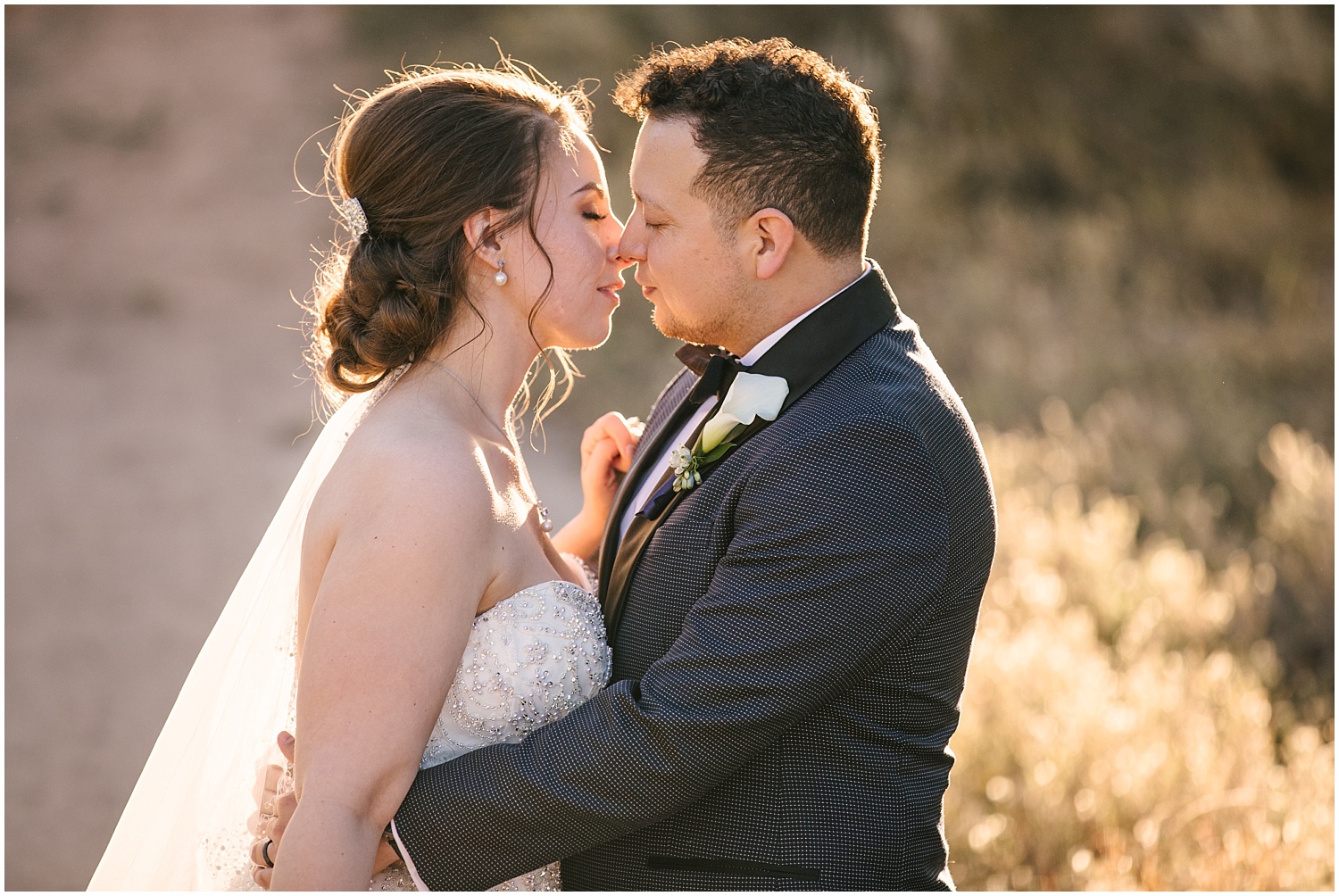 Bride and groom kissing during golden hour portraits at Prairie Star wedding