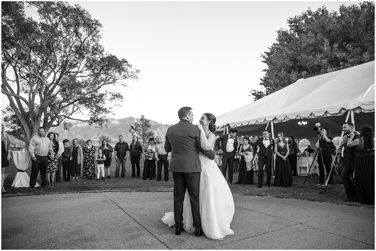 Bride and groom's first dance in front of the Sandia Mountains at Prairie Star Restaurant wedding reception