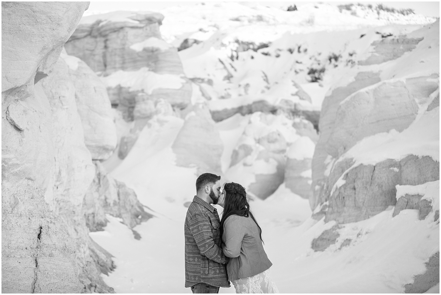 Bride and groom's first kiss at winter Paint Mines elopement in Colorado