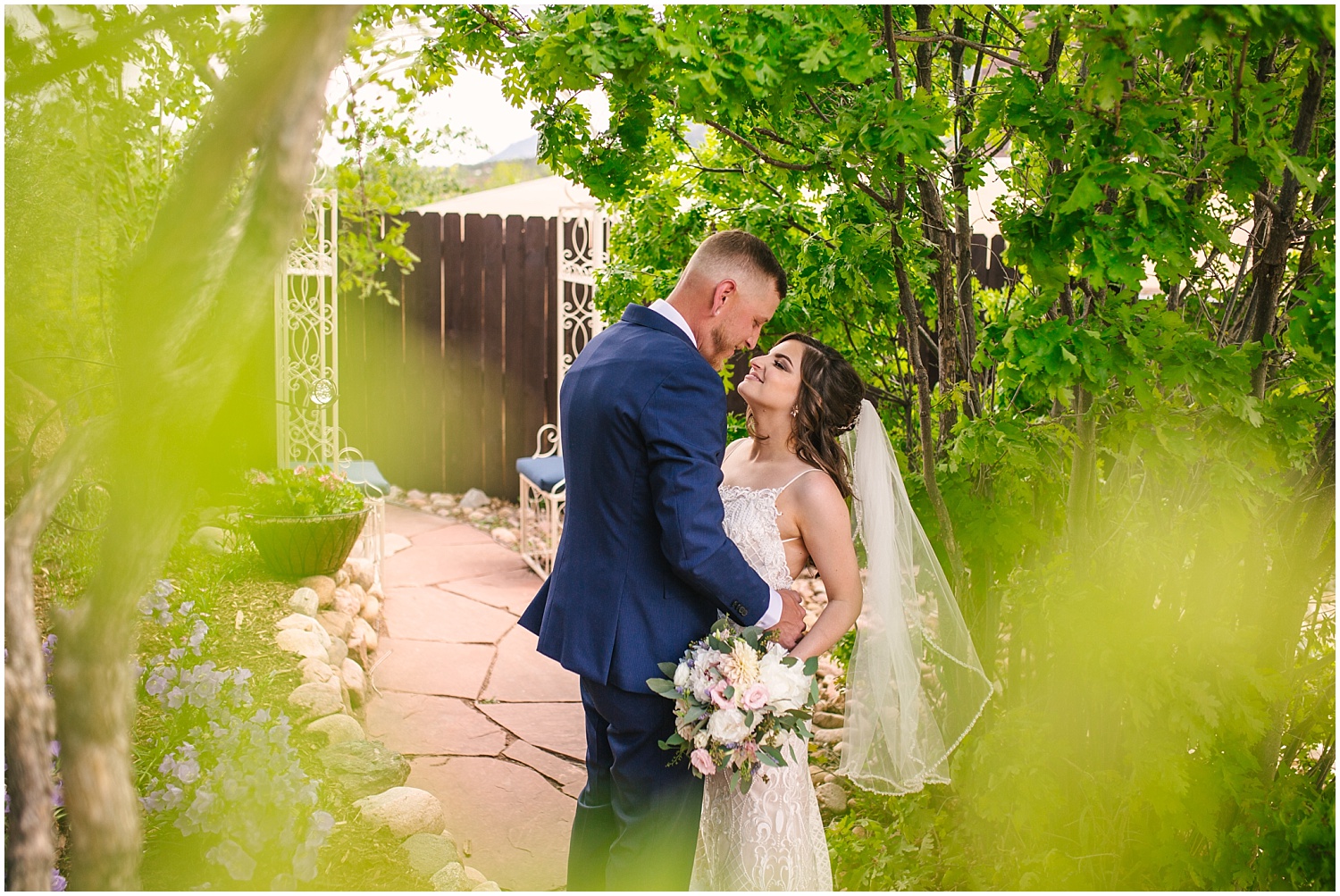 Bride and groom in the garden at Craftwood Inn wedding venue