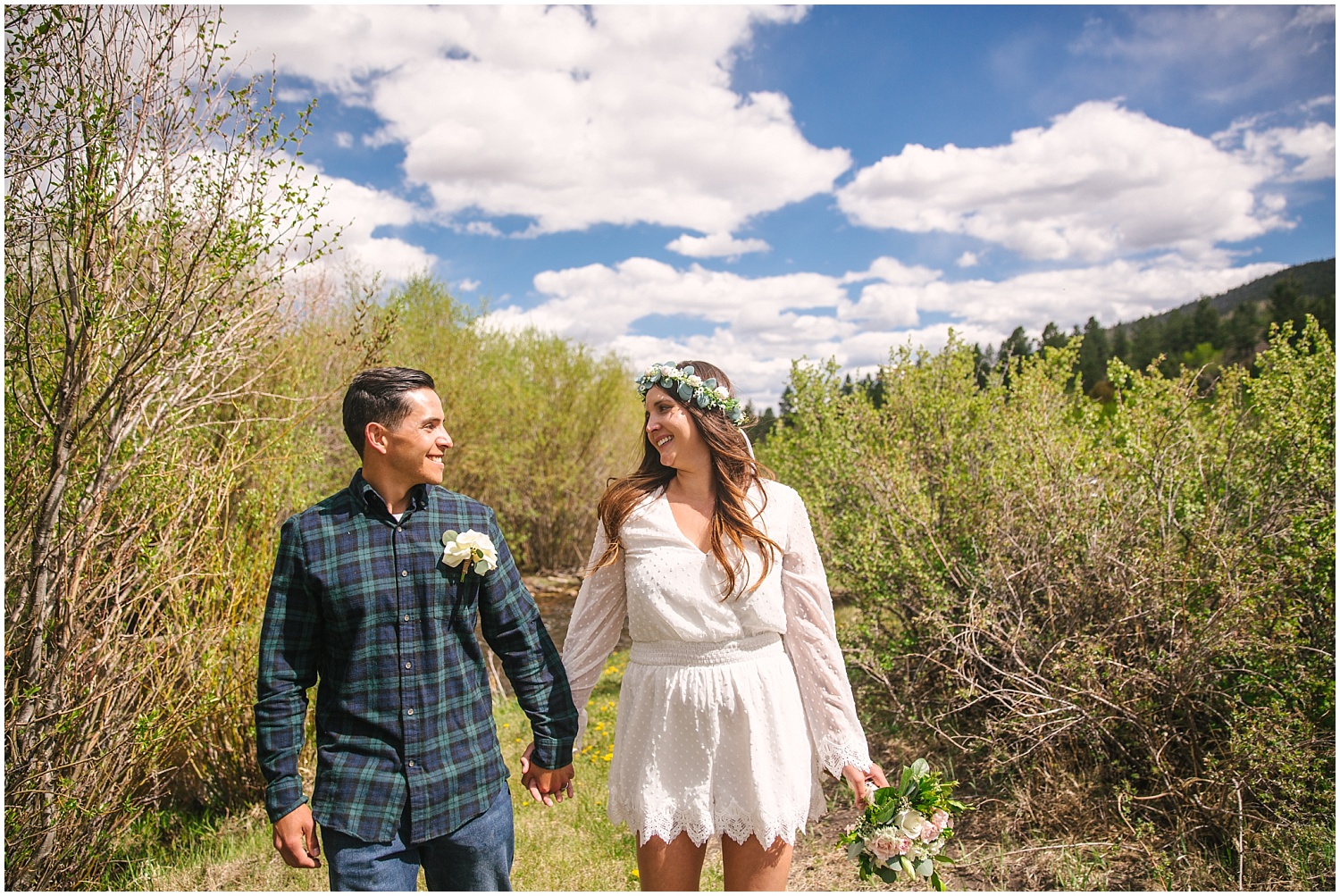Bride and groom holding hands at their Colorado elopement in the Rio Grande National Forest