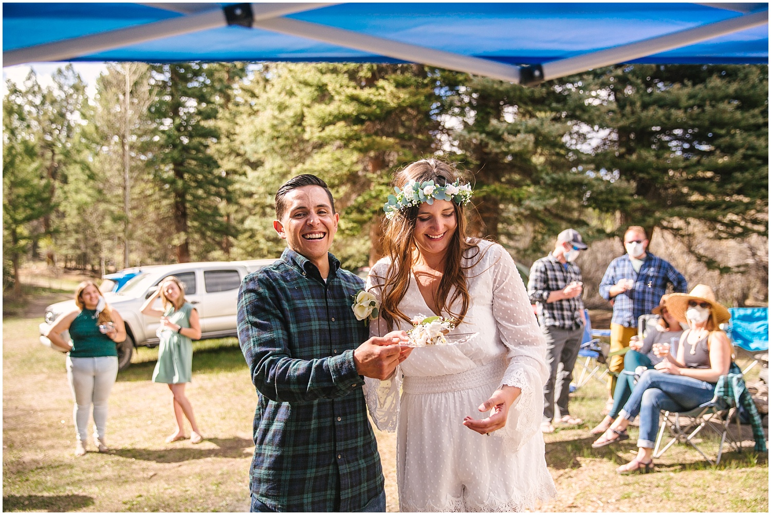 Bride and groom cut mini wedding cake at backcountry campsite elopement in Colorado