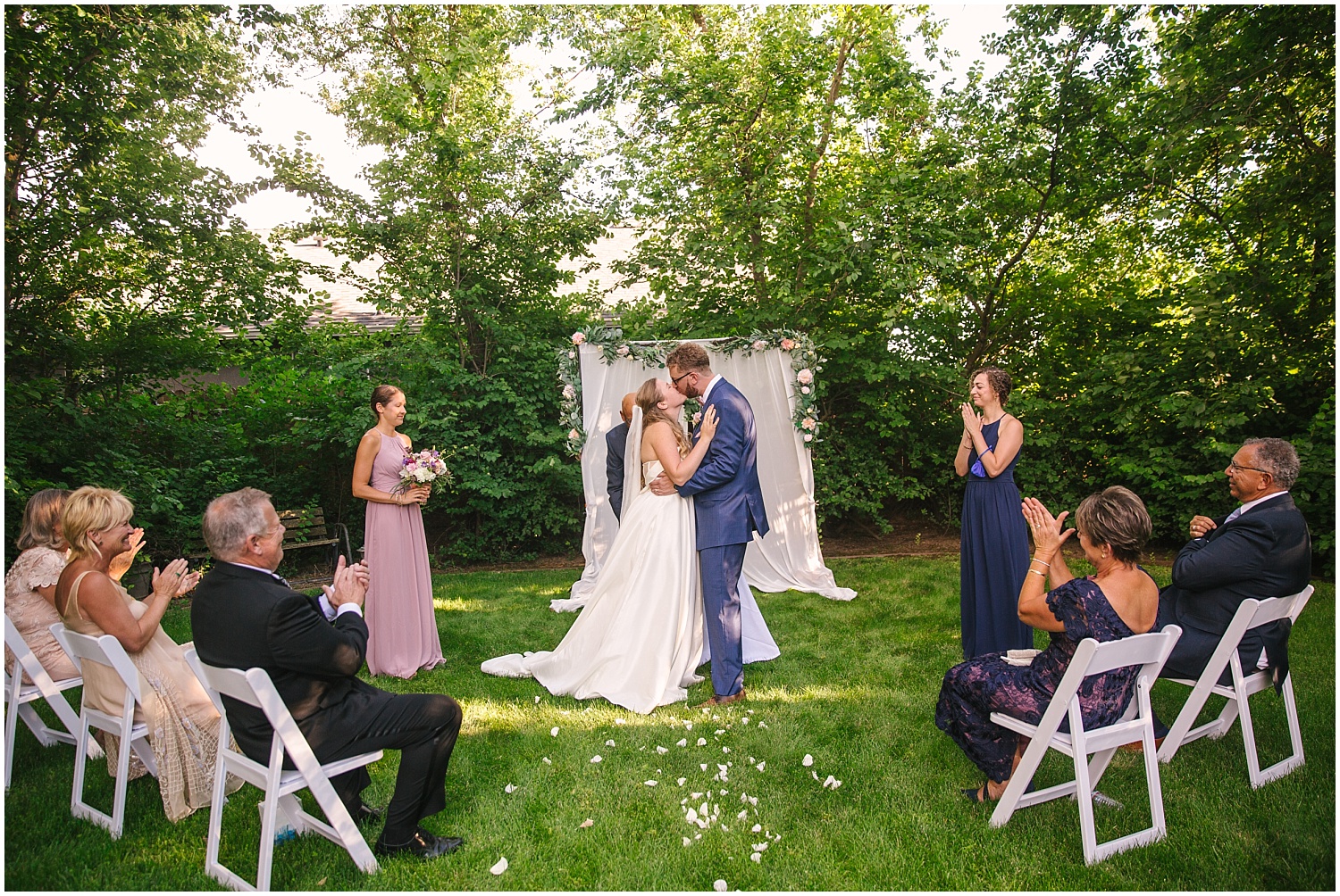 Bride and groom's first kiss at their intimate wedding ceremony