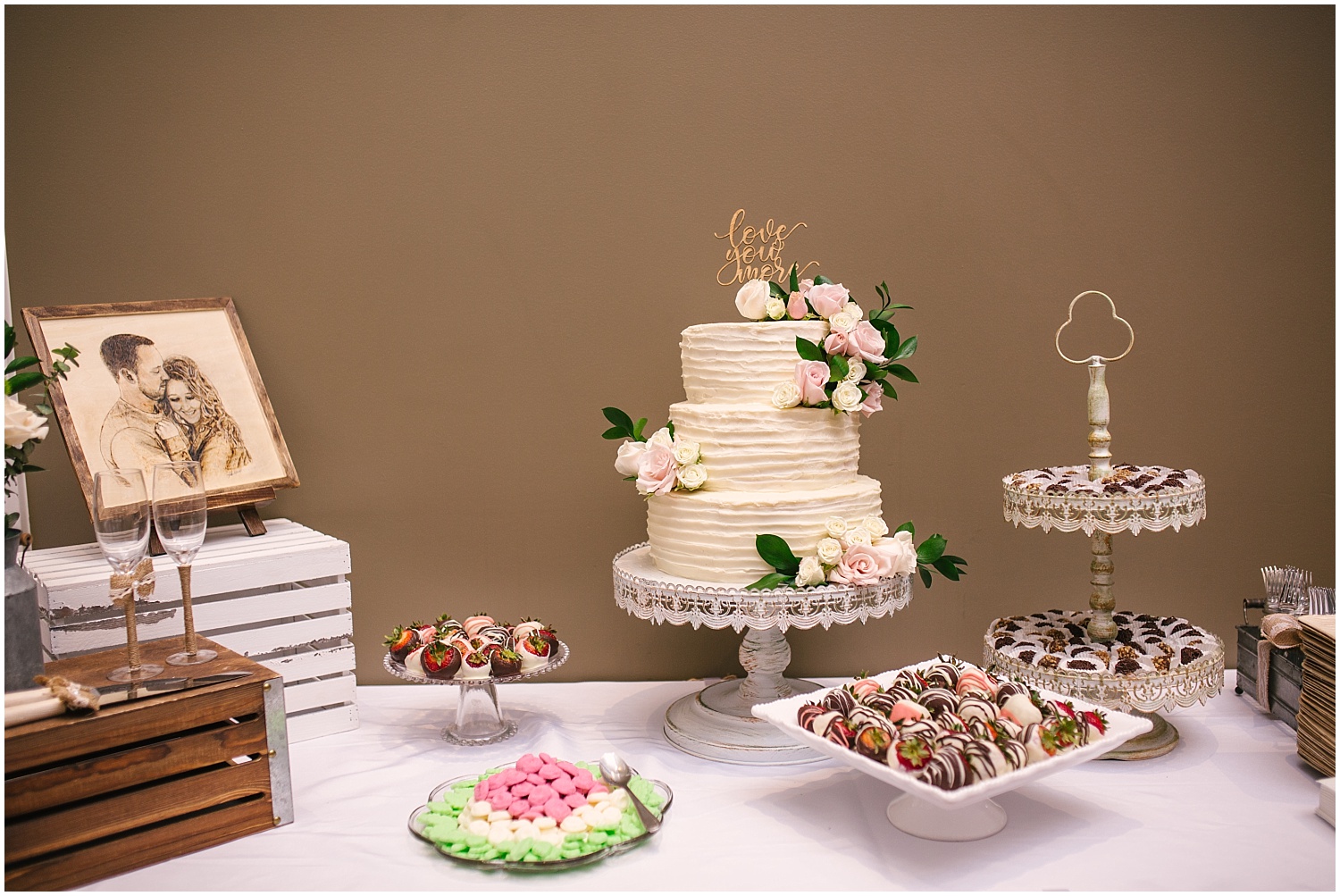 Wedding cake and chocolate candies at dessert table for Cordera wedding in Colorado Springs