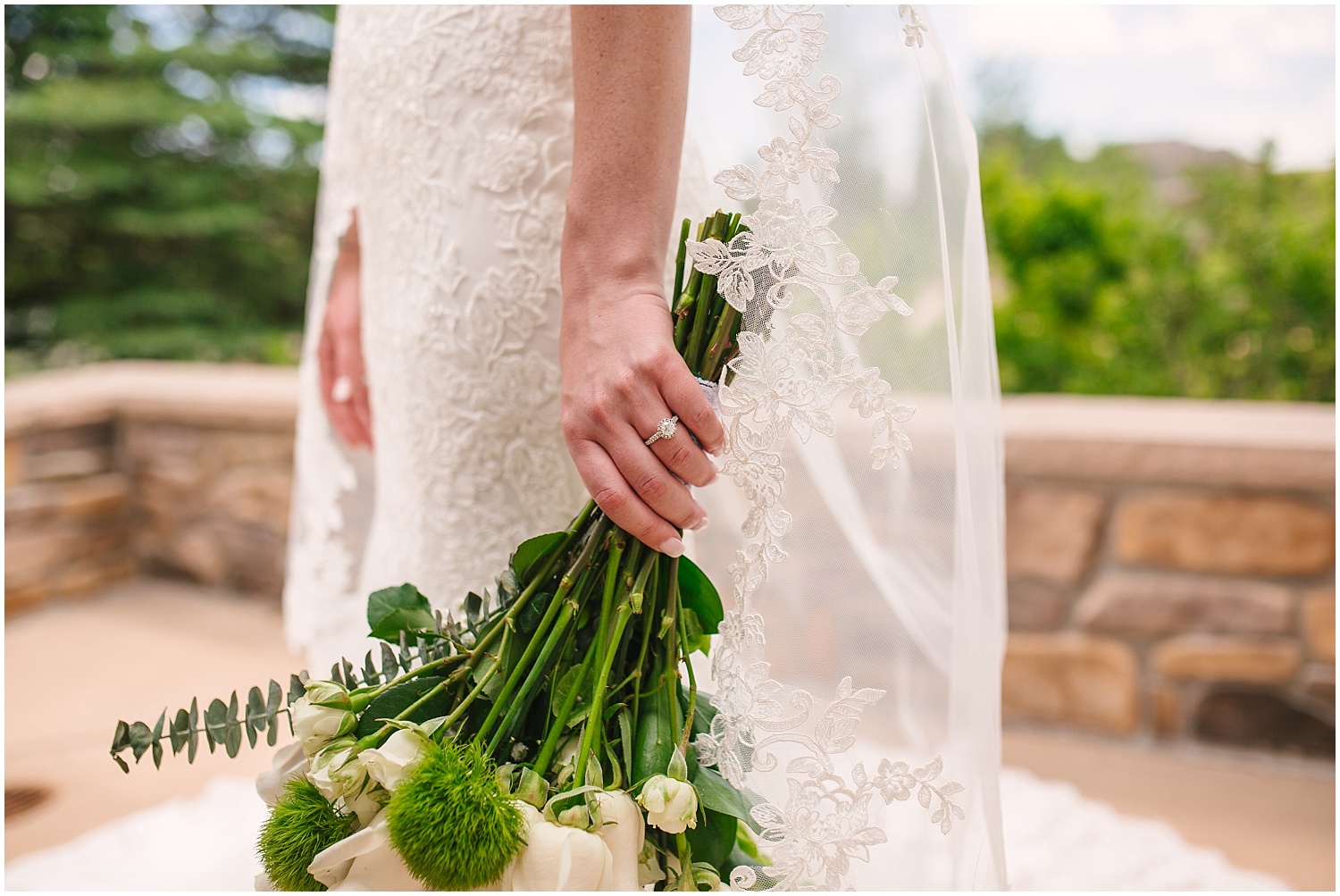 Bridal bouquet of white roses and natural greenery