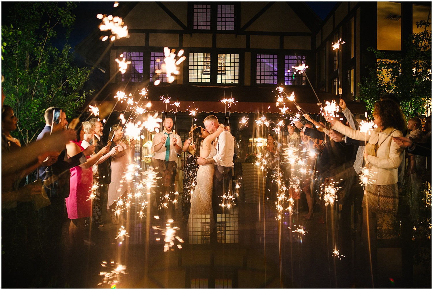 Bride and groom's sparkler exit from Craftwood Inn wedding in Manitou Springs