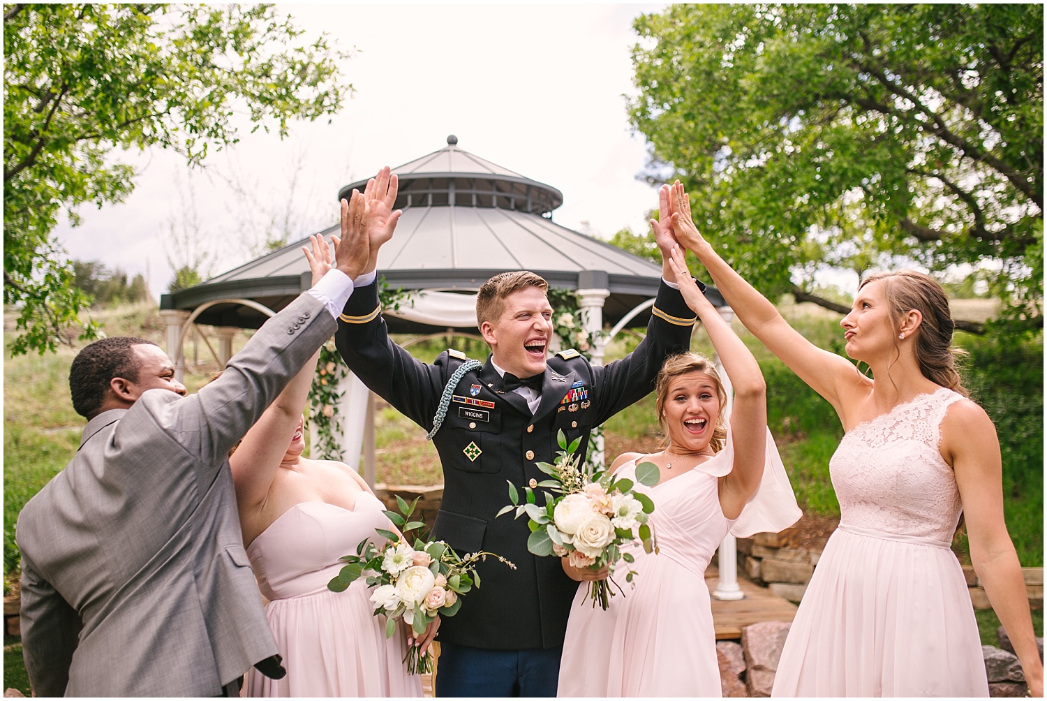 Groom high fives bridal party before wedding at Creekside Event Center