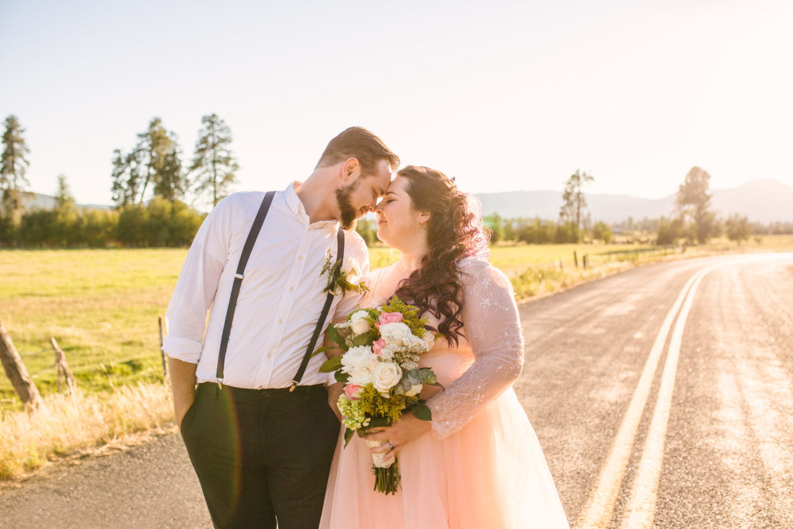 Bride and groom at golden hour at intimate mountain cabin wedding