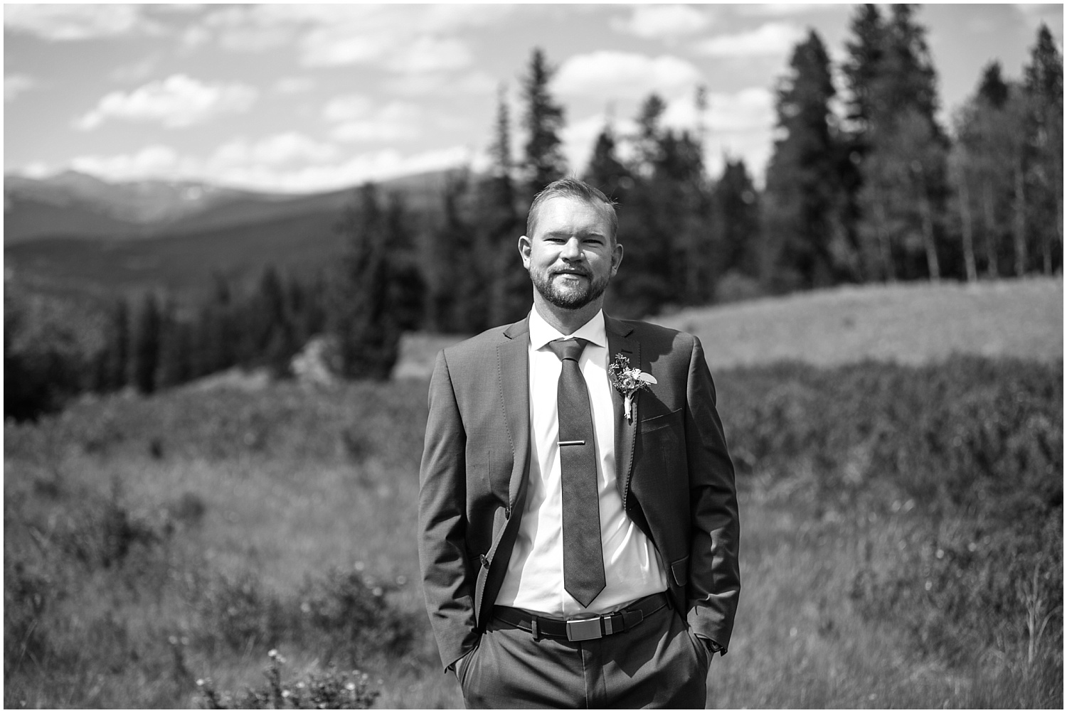 Black and white groom's portrait in the mountains of Kenosha Pass