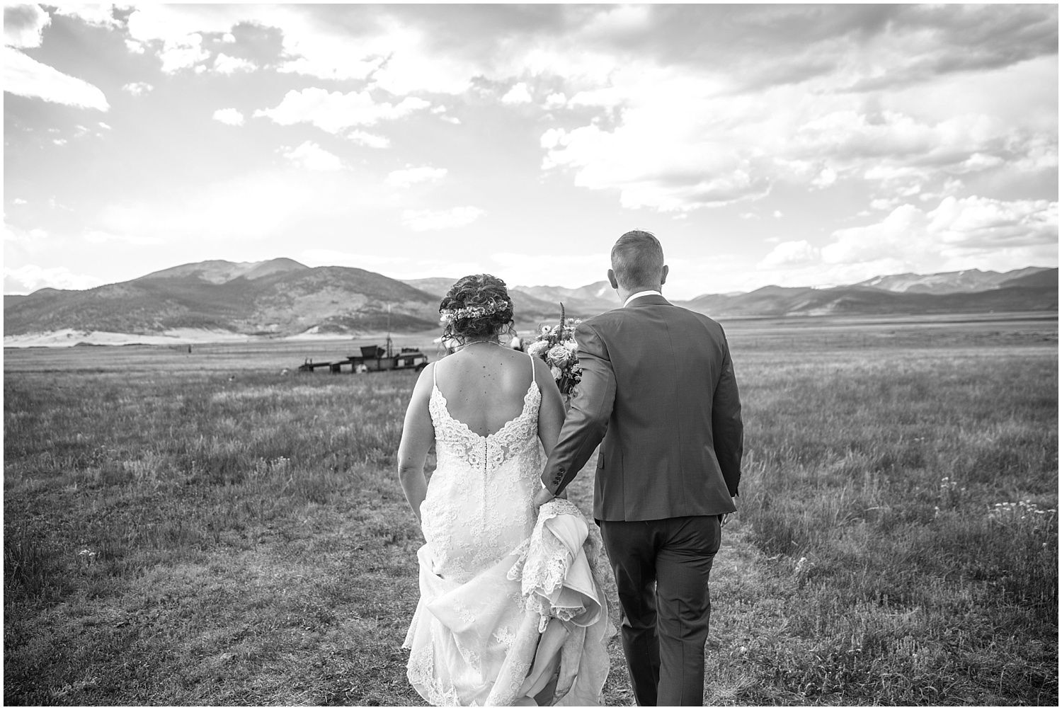 Bride and groom walking through field at Guyton Ranch