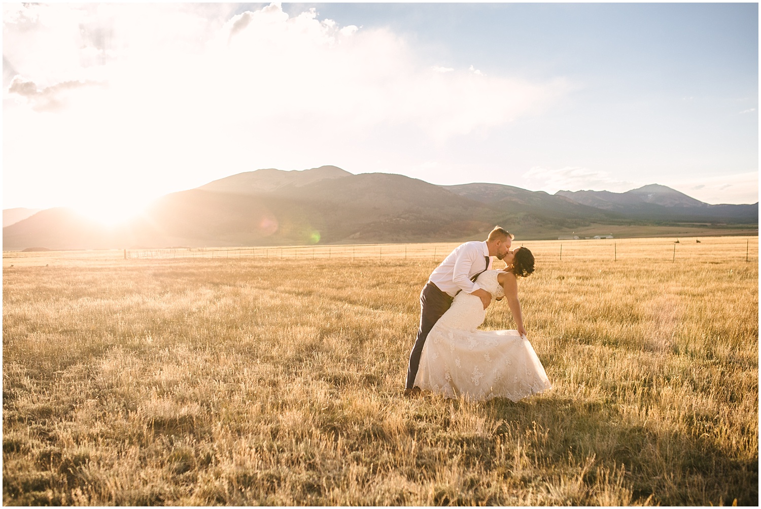 Bride and groom kissing at golden hour in the field at Guyton Ranch wedding