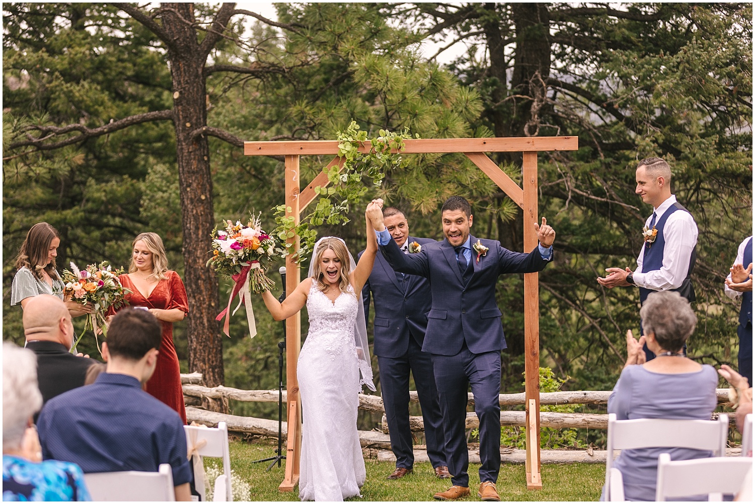 Bride and groom cheering after wedding ceremony in Durango Colorado
