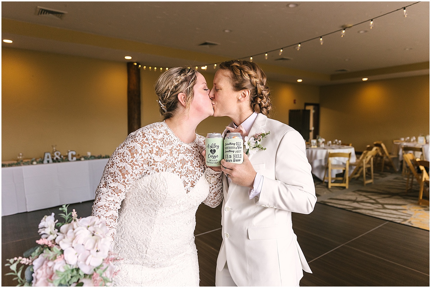 Brides toast beers with customized koozies 