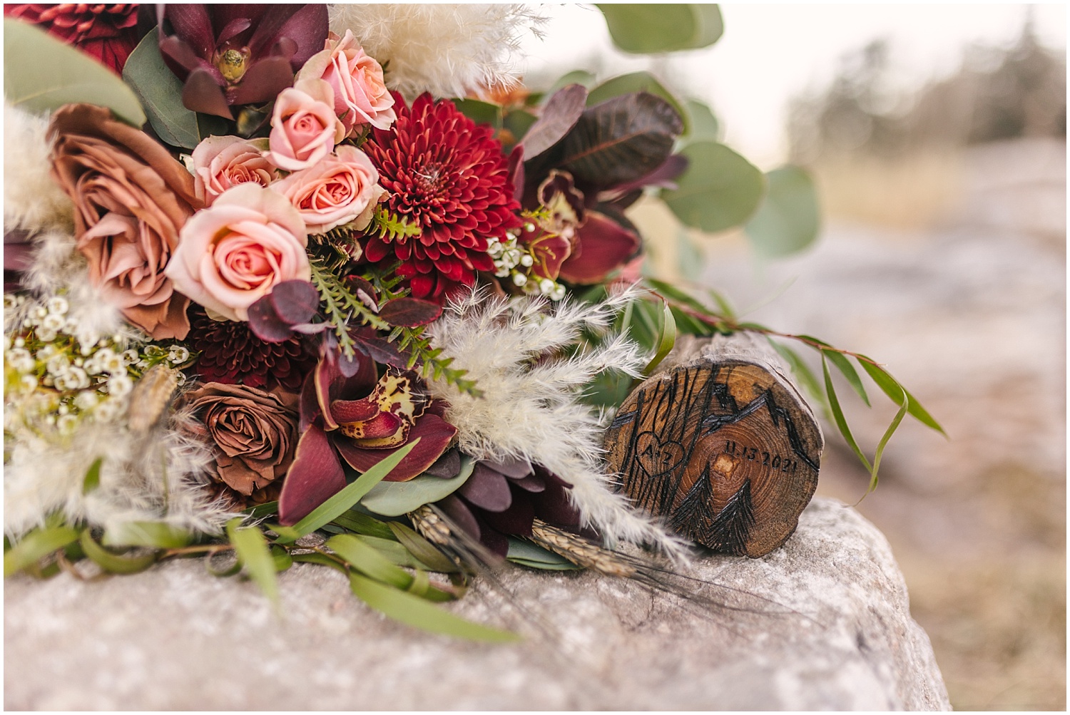 Winter elopement details with custom wooden ring box and bouquet by Floral Elegance Weddings