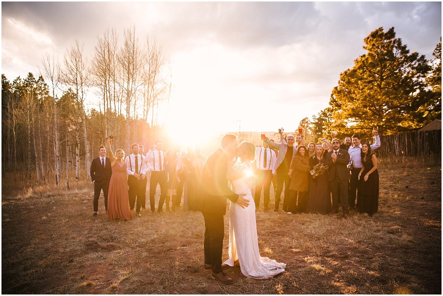 Bride and groom's first dance in a field at golden hour at intimate wedding in Woodland Park
