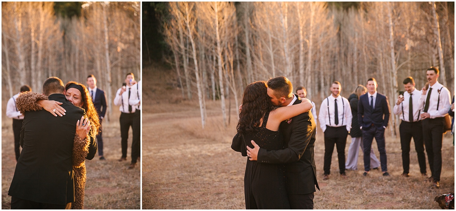 Groom dances with his mother in a field in the mountains for Woodland Park intimate wedding