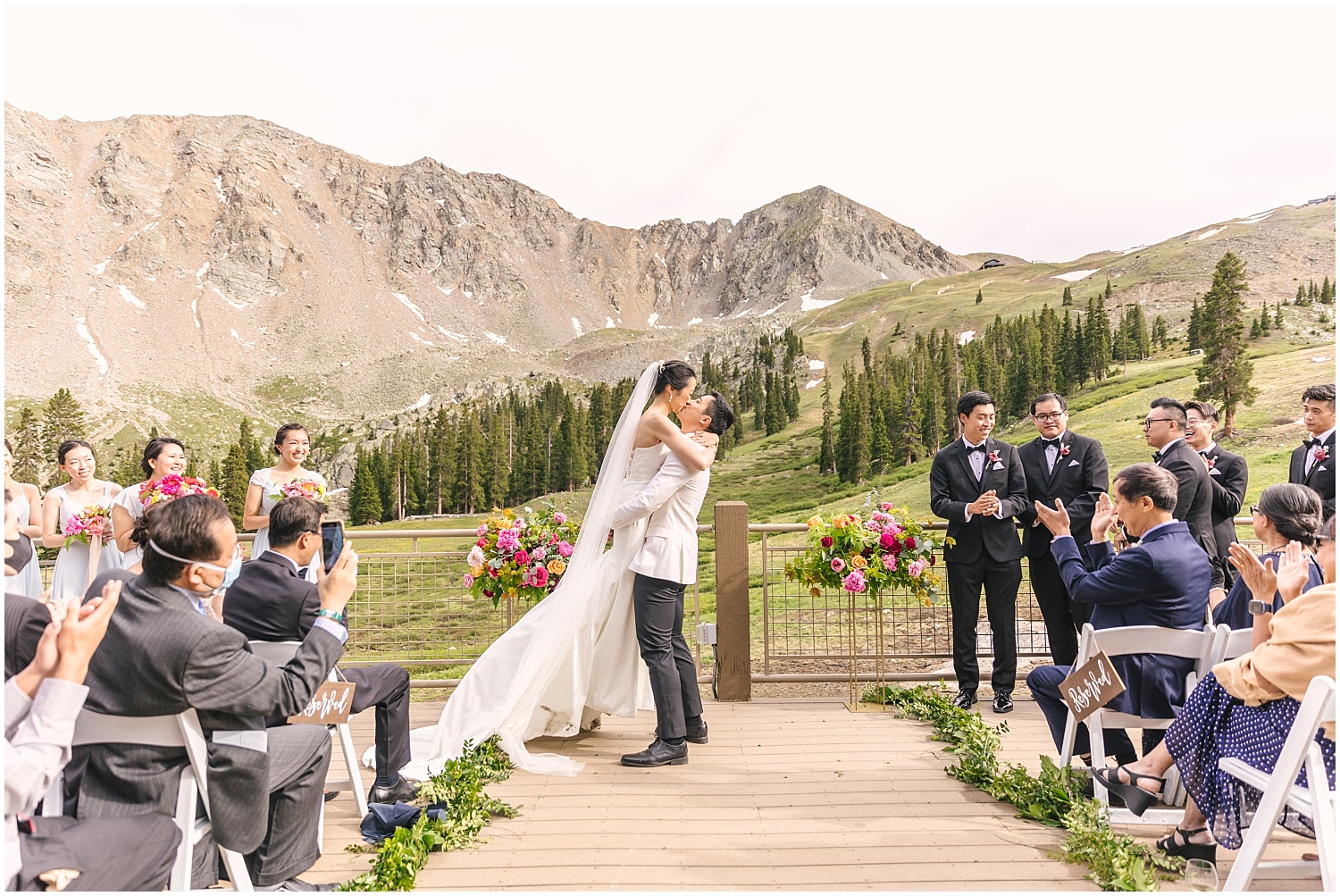 First kiss at Black Mountain Lodge wedding ceremony Arapahoe Basin
