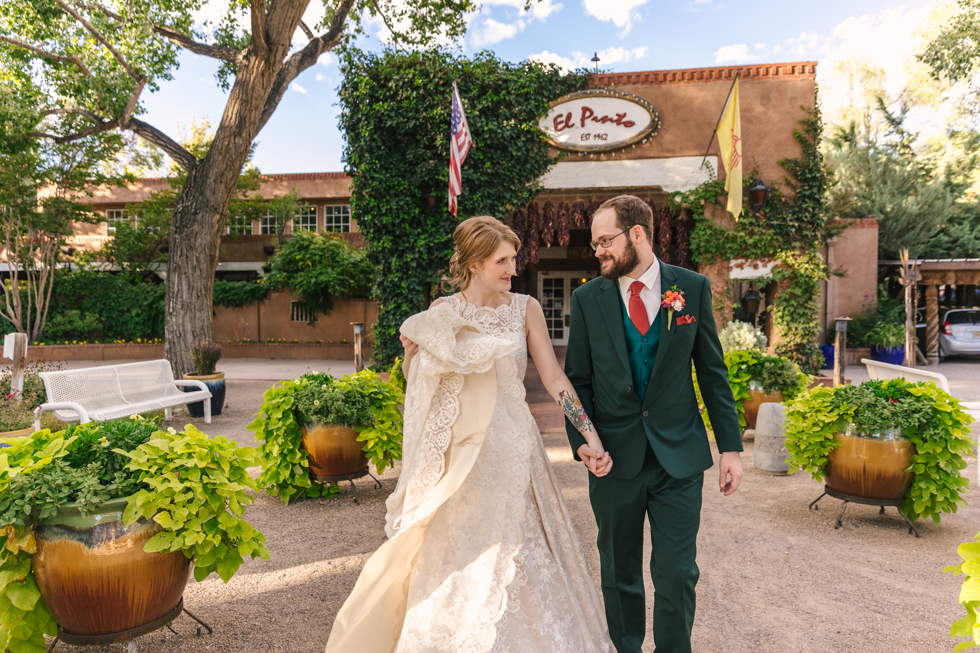 wedding portraits of bride and groom with iconic El Pinto Restaurant sign