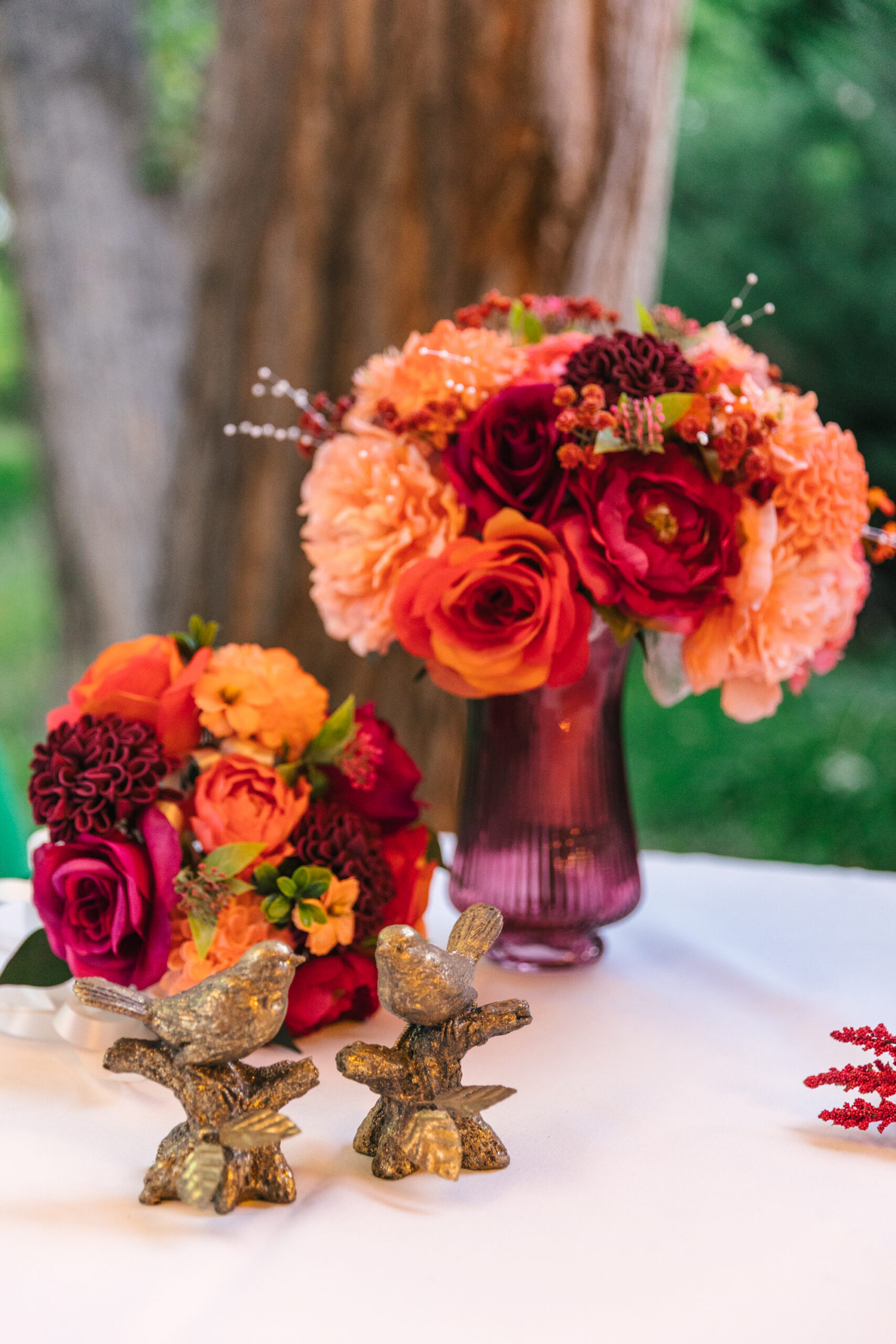 birds and bright pink florals as wedding details