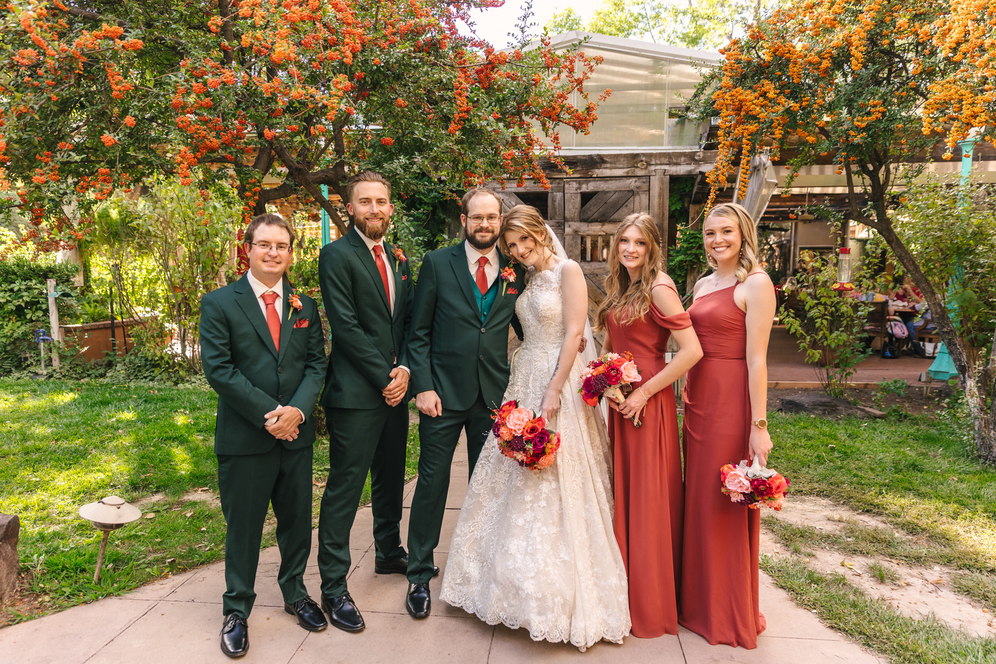 Green and coral orange wedding colors for September wedding at El Pinto Restaurant in Albuquerque