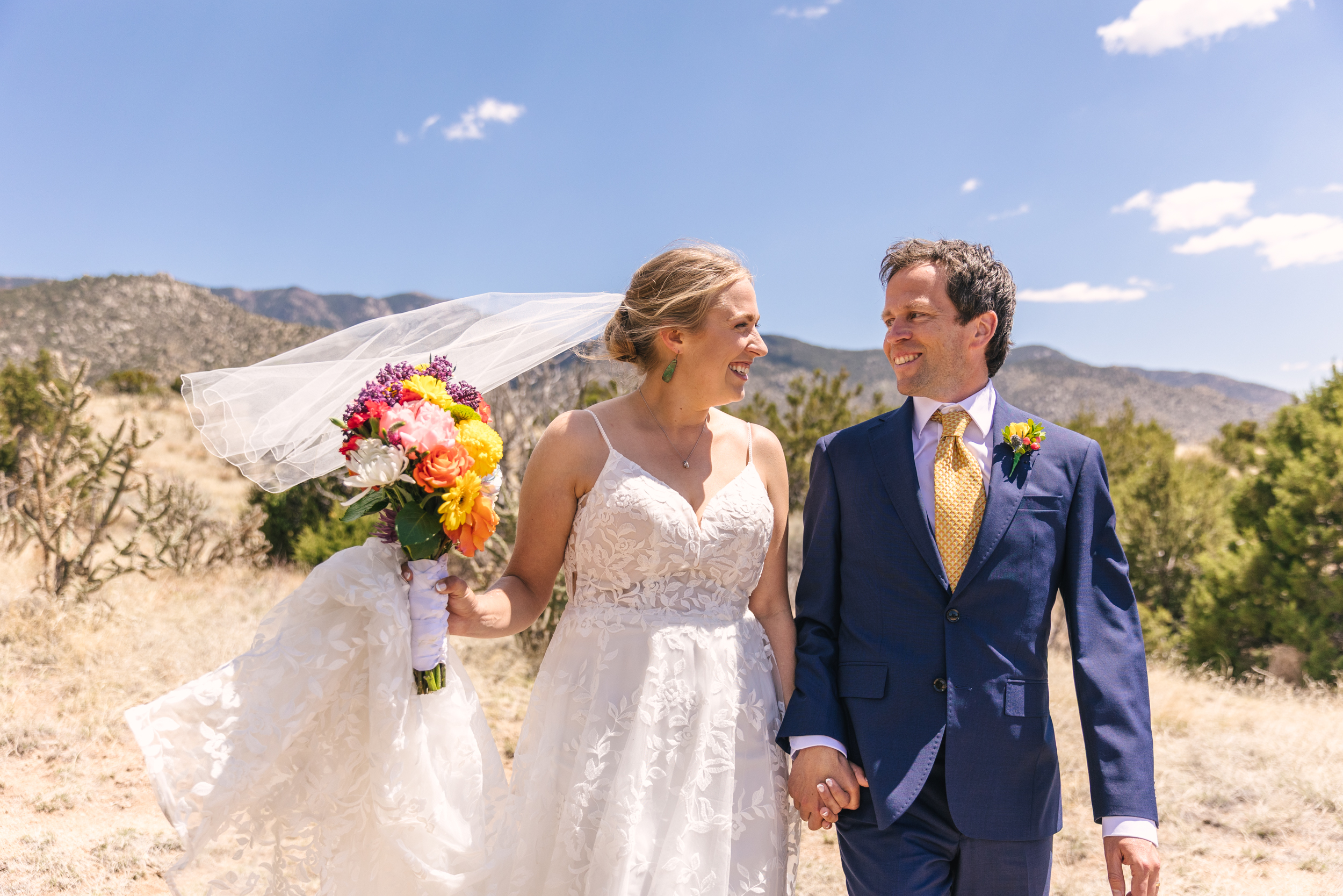 bride and groom in foothills of Sandia Mountains