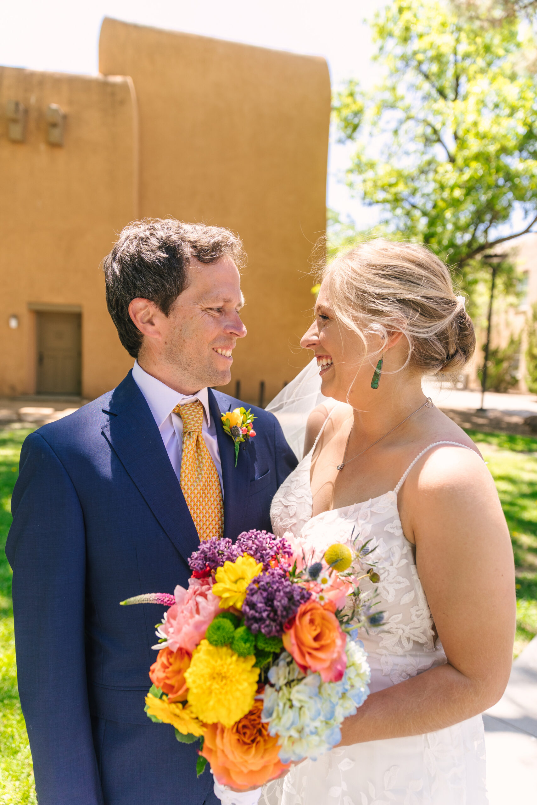 wedding portraits outside UNM Alumni Chapel in Albuquerque