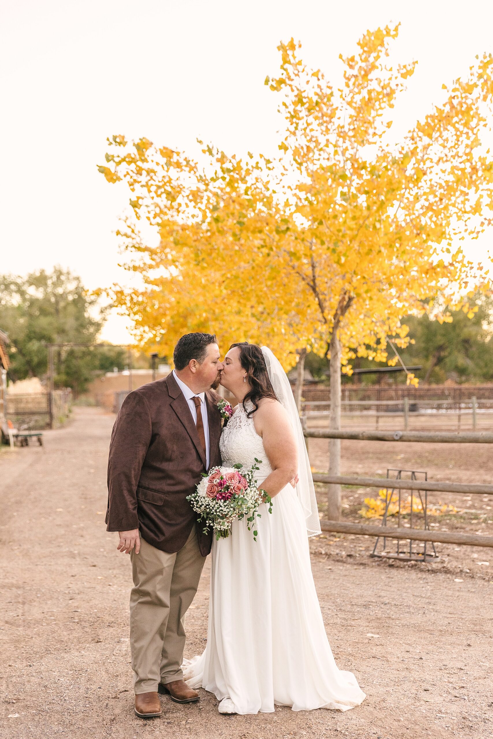 fall wedding portraits of bride and groom at Old Town Farm in Albuquerque