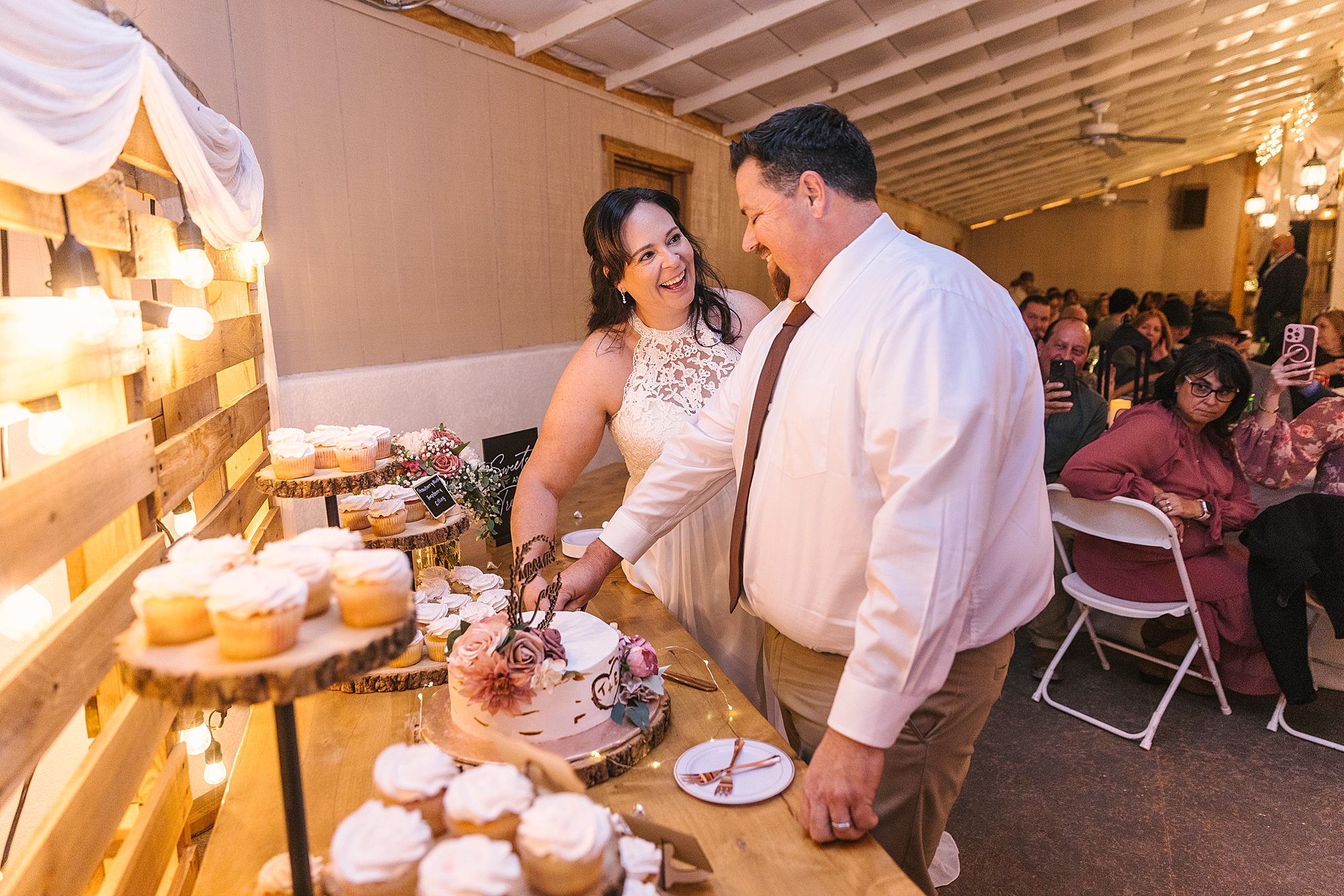 bride and groom cut the cake at Old Town Farm wedding