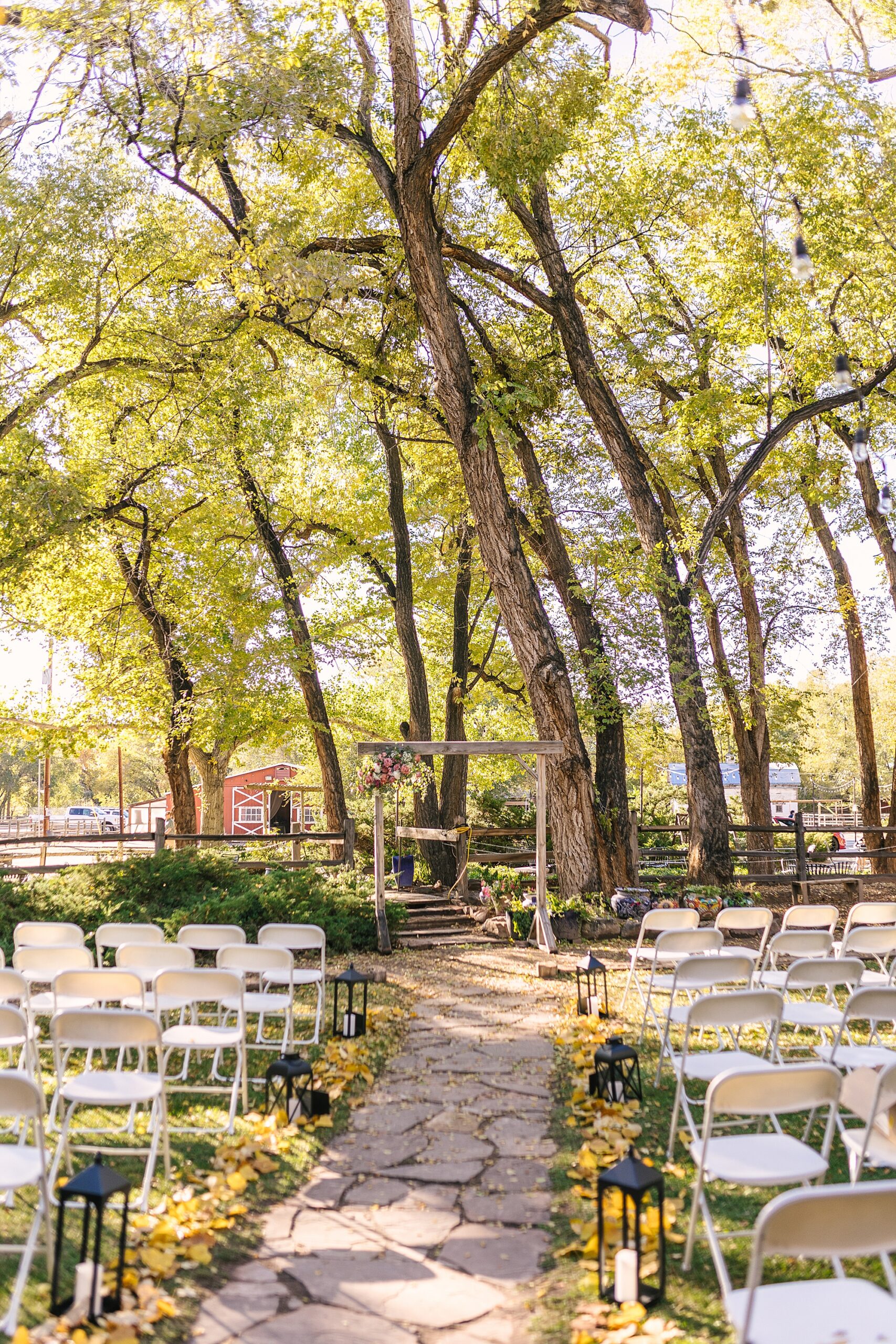 fall wedding ceremony under the cottonwoods at Old Town Farm wedding venue in Albuquerque