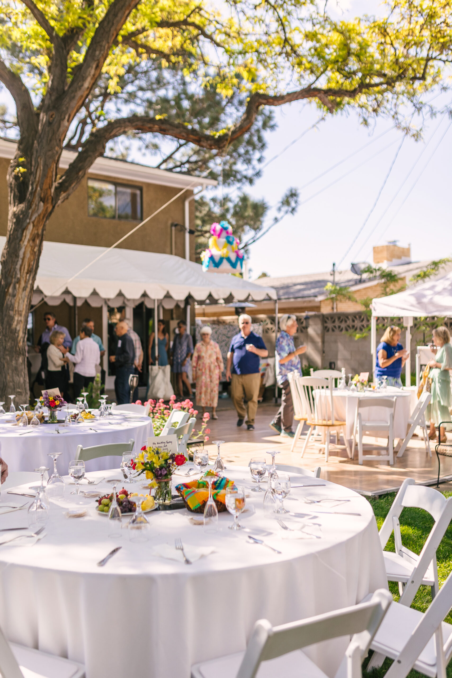 vibrant backyard wedding with a Mexican pinata