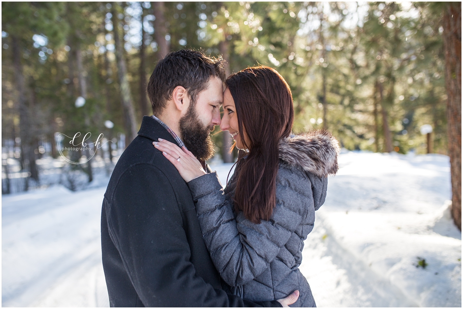 Couple in jackets in the snow at Lake Wenatchee State Park, Washington