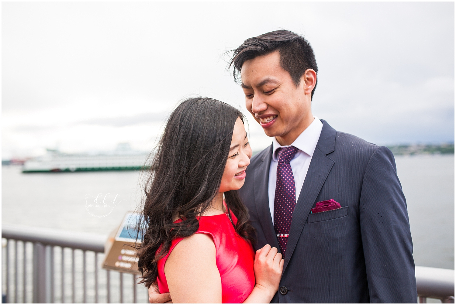 cute couple laughing together at Seattle waterfront