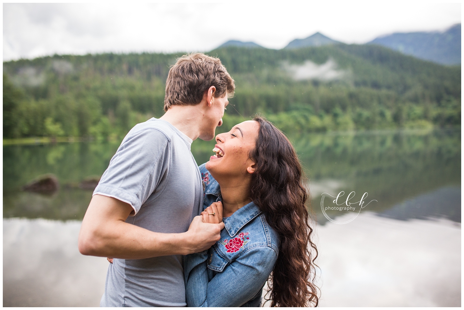 couple laughing together on a foggy day at Rattlesnake Lake in North Bend