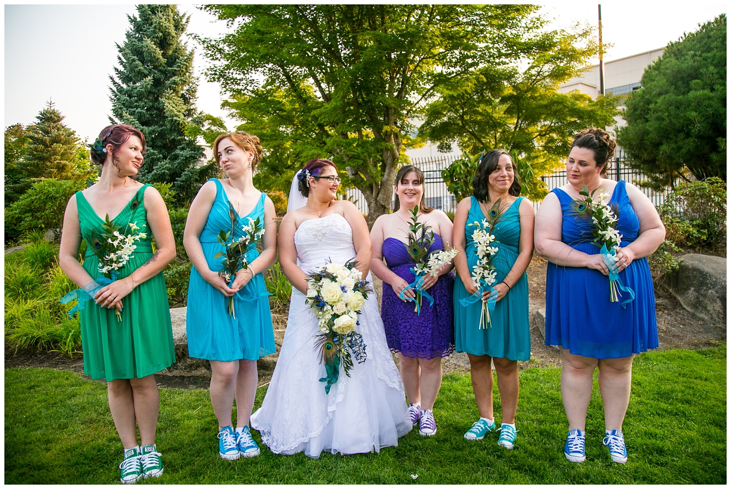 colorful bridal party portraits at peacock-themed Kitsap Conference Center wedding,