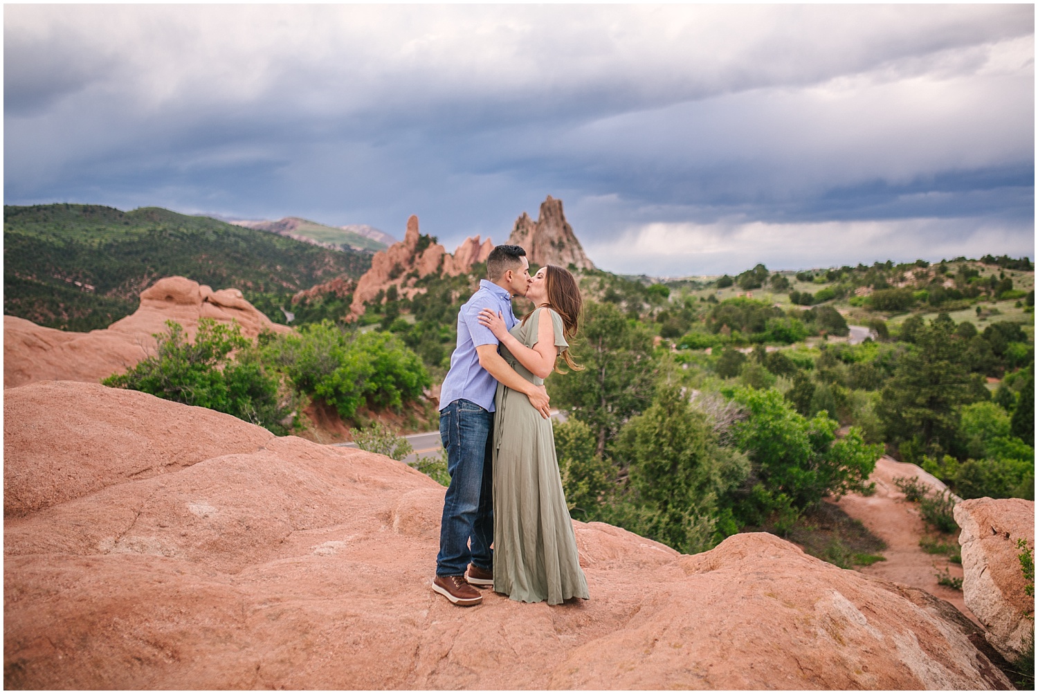 Couple kissing on red rocks at Garden of the Gods in Colorado Springs